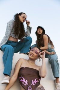 young-friends-posing-together-low-angle